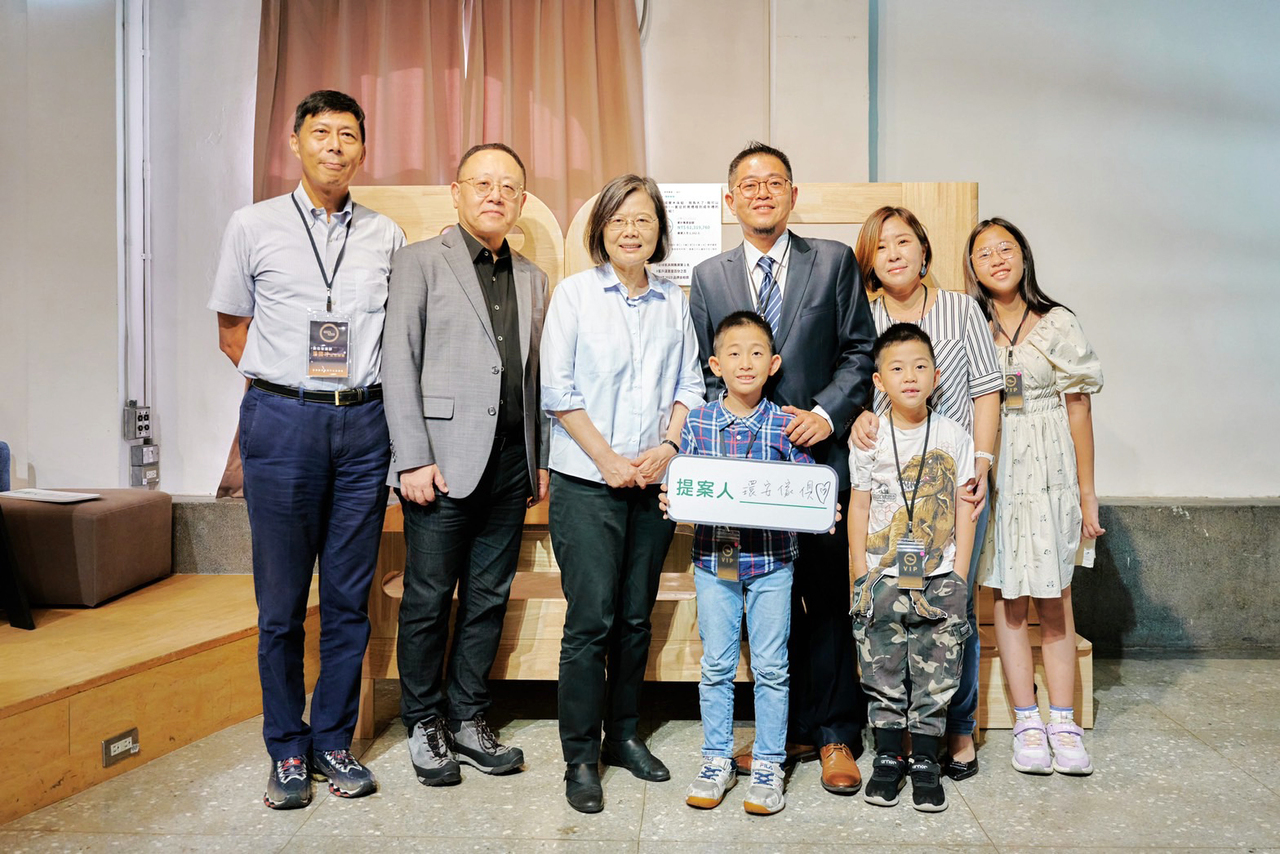 group picture with small signboard saying HA Furniture