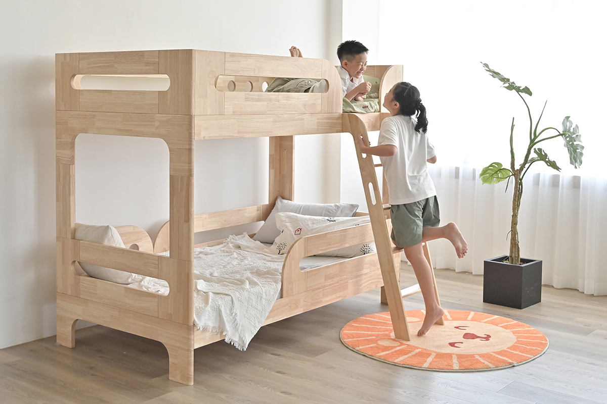 two kids testing out bed furniture
